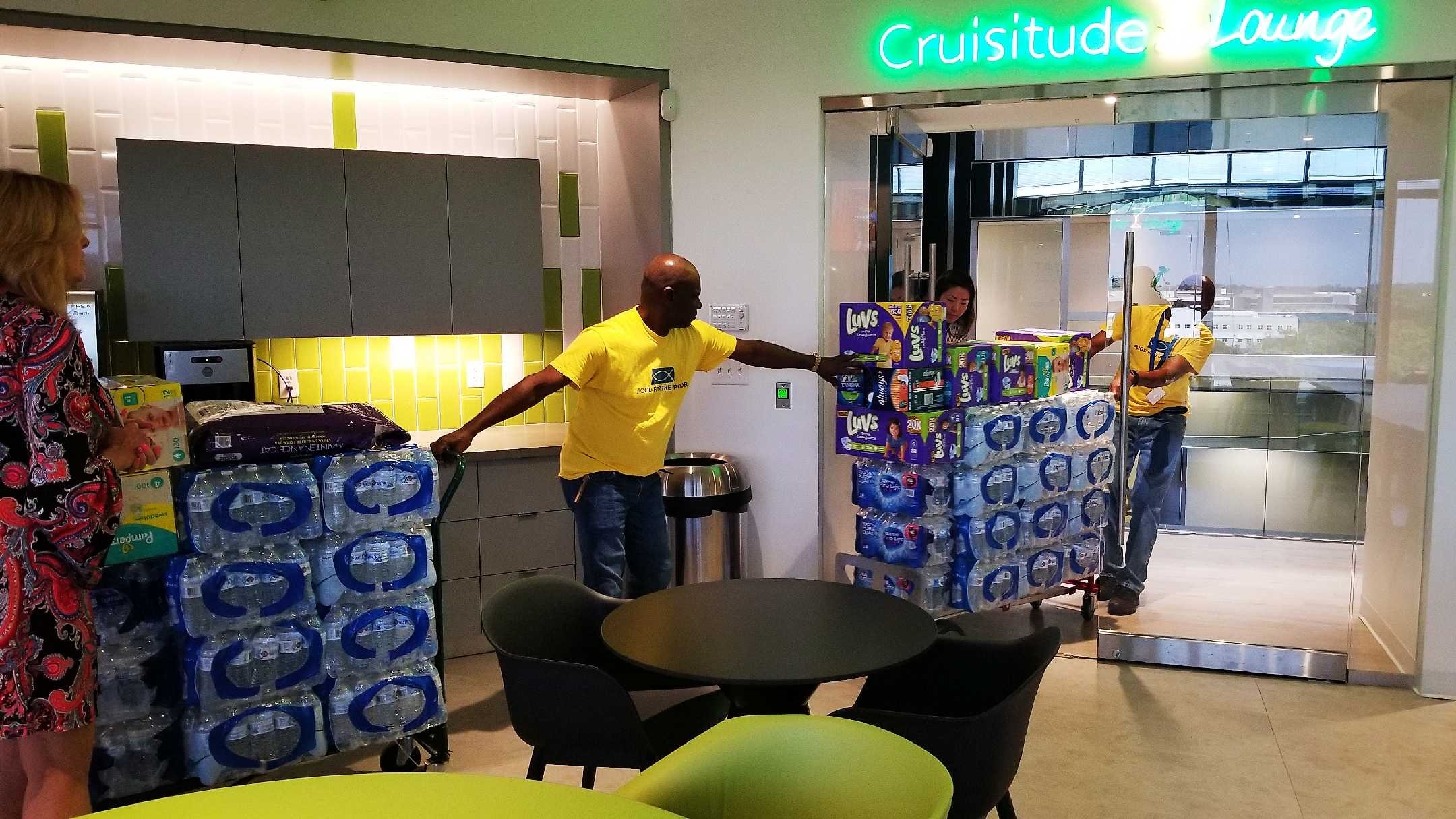 Fred and Marke from Food For The Poor picked up the donations made by the Cruise Planners Home Office Team